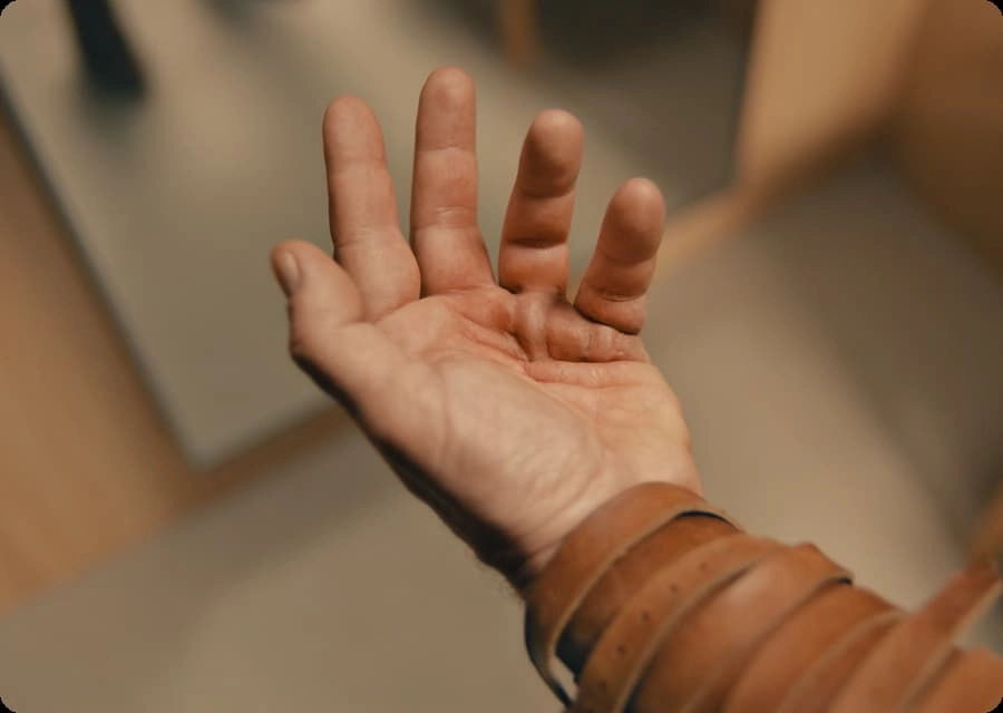 Open palm near tabletop surface