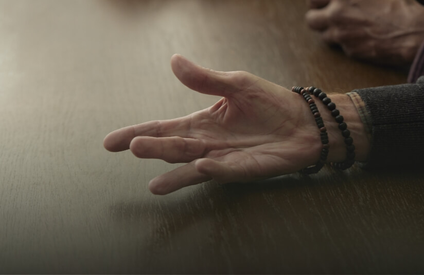 Thumbnail for a video called Emotional Effect, showing a person with Dupuytren's contracture holding their palm up